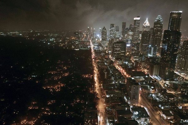 A dark residential street on the fifth day of a prolonged power outage