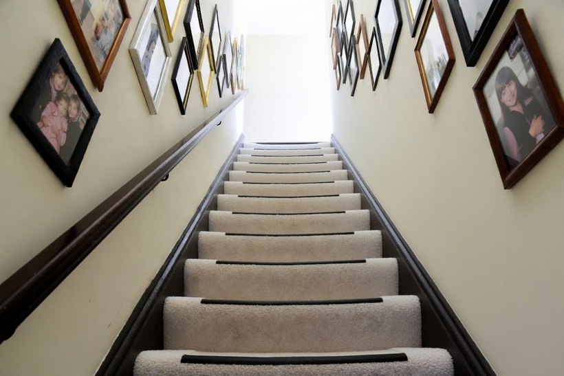 The same staircase with a dark contrasting strip along the front edge of every tread, so each step edge reads as a clear line
