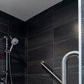 Horizontal and angled grab bars inside shower